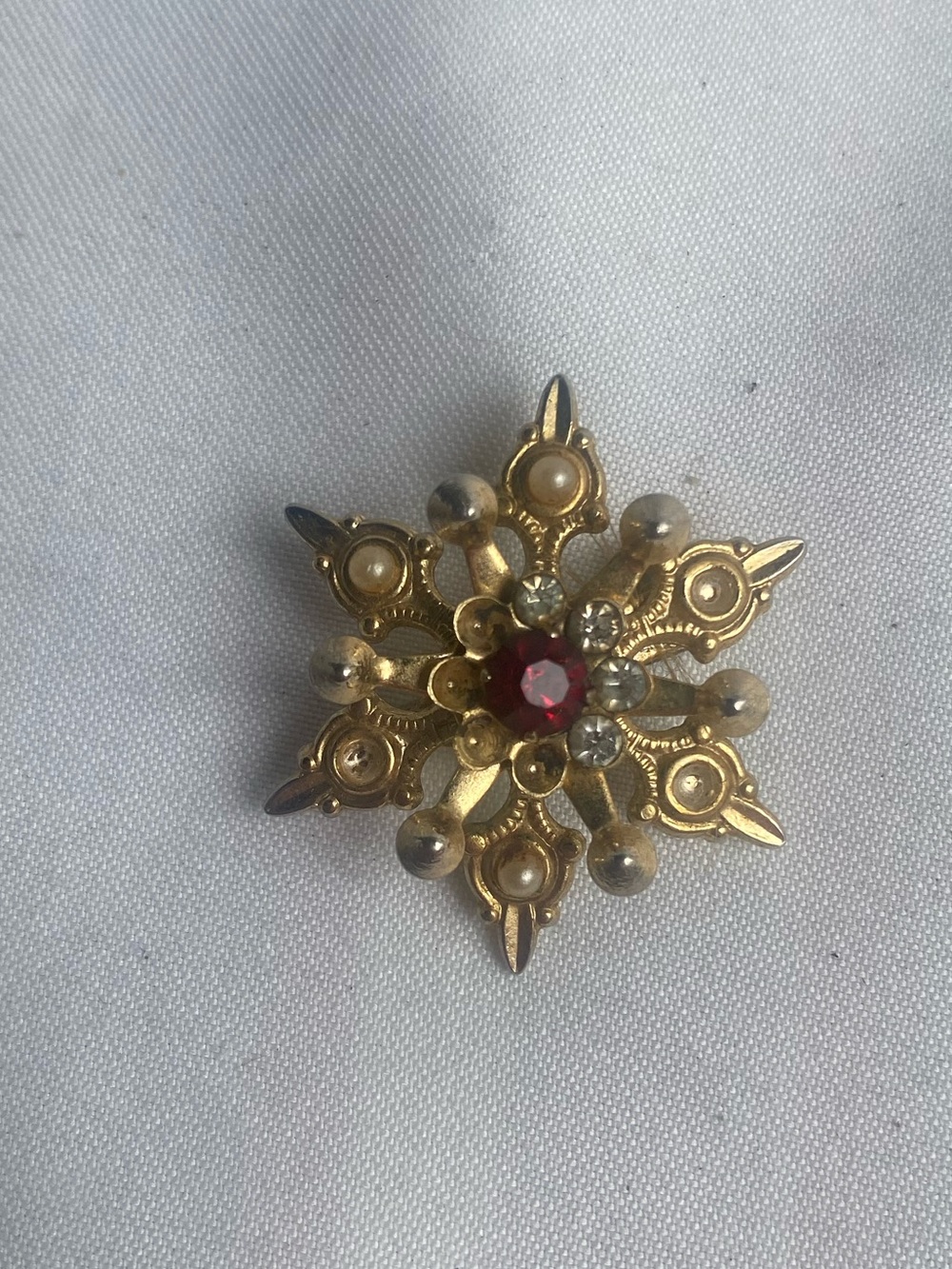 Tiny Gold-Tone Floral Star Brooch with Red Center Gem